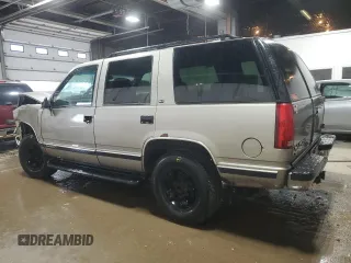 1999 GMC Yukon with VIN 1GKEK13R1XJ740648, listed as a Copart auction lot 82829084 with 211,002 mi miles and Salvage Title. Bid and sale history available at carsss.com. Image 2.