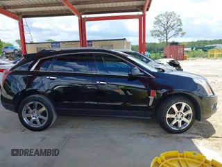 2012 Cadillac SRX Premium Collection z VIN 3GYFNCE36CS615725, wystawiony jako IAAI lot #42738584 z przebiegiem 156 625 mil mil oraz . Historia ofert i sprzedaży dostępna na DreamBid. Obrazek 13.