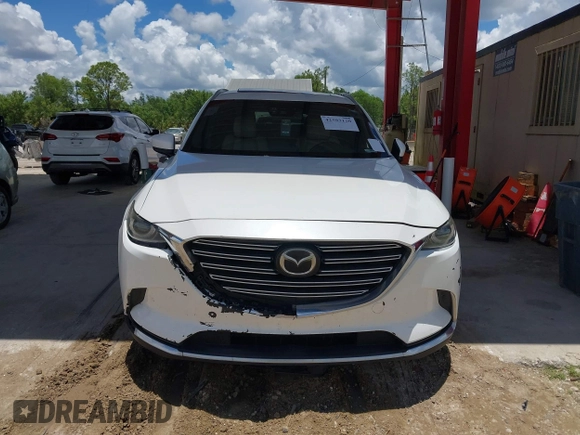 2016 Mazda CX-9 Grand Touring with VIN JM3TCADYXG0113563, listed as a IAAI auction lot 42593120 with 237,696 mi miles and . Bid and sale history available at DreamBid. Image 12.