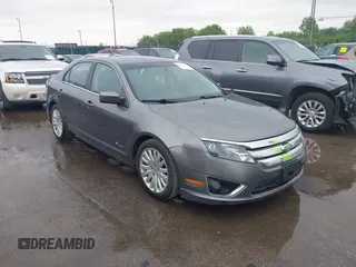 2010 Ford Fusion Hybrid z VIN 3FADP0L37AR242651, wystawiony jako IAAI lot #42457758 z przebiegiem 196 894 mil mil oraz . Historia ofert i sprzedaży dostępna na DreamBid. Obrazek 1.