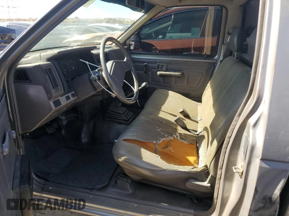 1987 Nissan Hardbody E z VIN JN6ND11SXHW014073, wystawiony jako Copart lot #78956934 z przebiegiem 381 885 mil mil oraz Szkody całkowita. Historia ofert i sprzedaży dostępna na DreamBid. Obrazek 7.