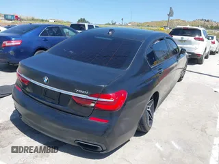 2018 BMW 7 Series 750i with VIN WBA7F0C51JGM23504, listed as a IAAI auction lot 39379378 with 82,251 mi miles. Bid and sale history available at carsss.com. Image 4.