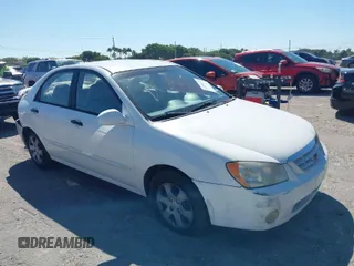 2004 Kia Spectra LX with VIN KNAFE121645055839, listed as a IAAI auction lot 41784614 with 118,874 mi miles. Bid and sale history available at carsss.com. Image 1.