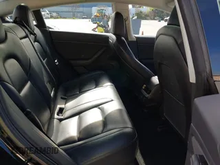 2019 Tesla Model 3 Mid Range with VIN 5YJ3E1EA2KF305834, listed as a IAAI auction lot 41719610 with 126,333 mi miles and . Bid and sale history available at DreamBid. Image 8.