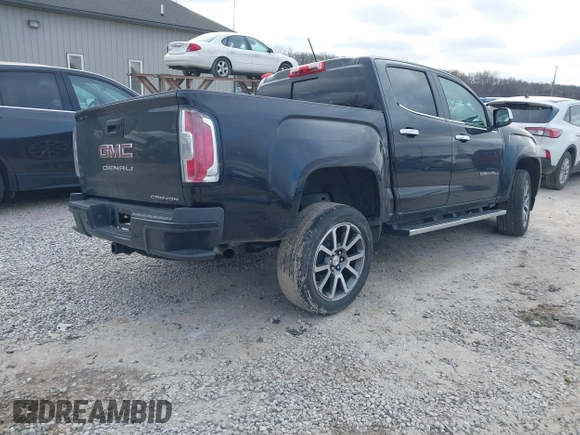2021 GMC Canyon 4WD Denali with VIN 1GTG6EEN9M1221529, listed as a IAAI auction lot 41228498 with 67,727 mi miles. Bid and sale history available at carsss.com. Image 4.
