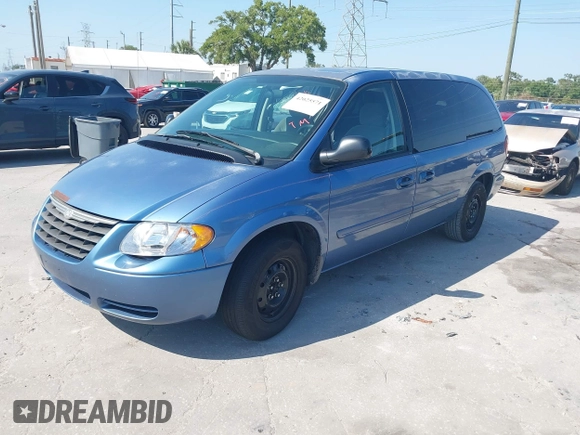 2007 Chrysler Town & Country LWB LX with VIN 2A4GP44R77R246063, listed as a IAAI auction lot 42025571 with 302,541 mi miles. Bid and sale history available at carsss.com. Image 2.