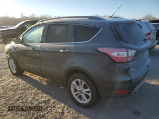 2018 Ford Escape SE z VIN 1FMCU9GD7JUA19262, wystawiony jako Copart lot #84627944 z przebiegiem 89 993 mil mil oraz Szkoda całkowita • Salvage title. Historia ofert i sprzedaży dostępna na DreamBid. Obrazek 2.