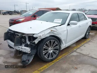 2013 Chrysler 300 with VIN 2C3CCABGXDH735739, listed as a IAAI auction lot 41282492 with 121,487 mi miles. Bid and sale history available at carsss.com. Image 2.