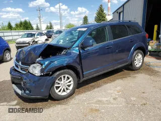 2013 Dodge Journey SXT with VIN 3C4PDCCG1DT637534, listed as a Copart auction lot 56992205 with 128,531 mi miles and Clean title. Bid and sale history available at DreamBid. Image 1.