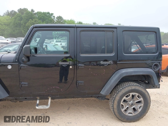 2015 Jeep Wrangler Unlimited Rubicon with VIN 1C4BJWFG7FL688728, listed as a IAAI auction lot 42054304 with 100,152 mi miles and . Bid and sale history available at DreamBid. Image 14.