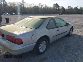 1995 Ford Thunderbird LX with VIN 1FALP62WXSH147871, listed as a IAAI auction lot 41878652 with 95,305 mi miles. Bid and sale history available at carsss.com. Image 4.