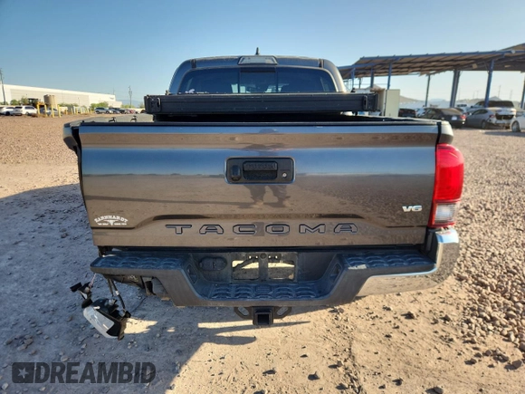 2018 Toyota Tacoma SR5 с VIN 3TMAZ5CN5JM066282, выставлен на аукционе Copart как лот 61197145 с пробегом 85 916 миль миль и Списание • Salvage title. История ставок и продаж доступна на DreamBid. Изображение 6.