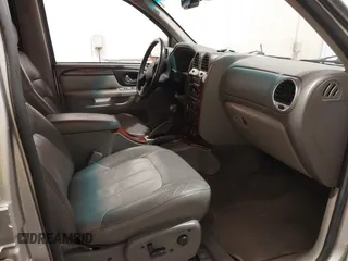 2004 GMC Envoy SLE with VIN 1GKDT13S042243883, listed as a IAAI auction lot 41795335 with 162,873 mi miles. Bid and sale history available at carsss.com. Image 5.