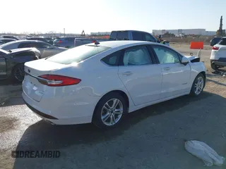 2018 Ford Fusion Hybrid SE with VIN 3FA6P0LU7JR188124, listed as a IAAI auction lot 41760184 with 74,731 mi miles. Bid and sale history available at carsss.com. Image 4.