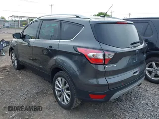 2017 Ford Escape Titanium z VIN 1FMCU0JD9HUE03672, wystawiony jako IAAI lot #42411549 z przebiegiem 89 846 mil mil oraz . Historia ofert i sprzedaży dostępna na DreamBid. Obrazek 3.