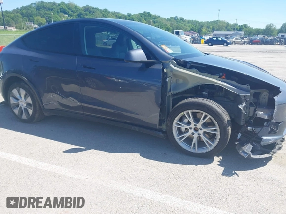 2023 Tesla Model Y Long Range with VIN 7SAYGDEE4PA037218, listed as a IAAI auction lot 42232704 with 18,756 mi miles and . Bid and sale history available at DreamBid. Image 6.
