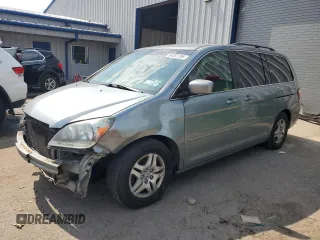 2007 Honda Odyssey EX with VIN 5FNRL38407B095436, listed as a Copart auction lot 64361795 with 154,993 mi miles and Salvage title. Bid and sale history available at DreamBid. Image 1.