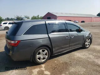 2012 Honda Odyssey Touring with VIN 5FNRL5H90CB505590, listed as a Copart auction lot 62566715 with 323,092 mi miles and Clean title. Bid and sale history available at DreamBid. Image 3.