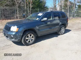 2008 Jeep Grand Cherokee Laredo with VIN 1J8GR48K98C161239, listed as a IAAI auction lot 42090850 with 218,063 mi miles. Bid and sale history available at carsss.com. Image 2.