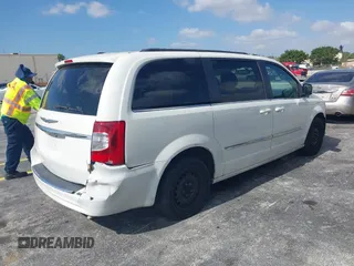 2012 Chrysler Town & Country Touring with VIN 2C4RC1BG9CR251902, listed as a IAAI auction lot 42165738 with 147,218 mi miles. Bid and sale history available at carsss.com. Image 4.