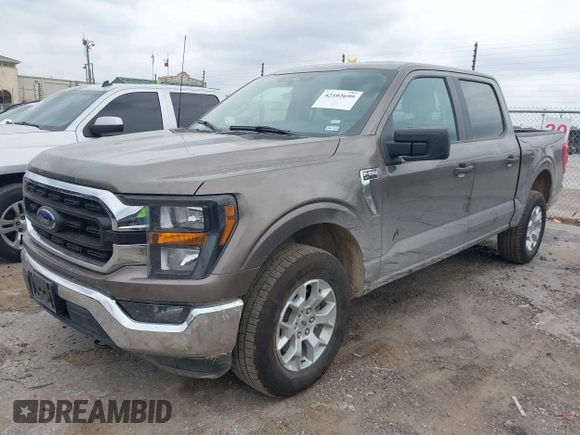 2023 Ford F-150 XL with VIN 1FTFW1E81PFB71702, listed as a IAAI auction lot 42102699 with 57,007 mi miles. Bid and sale history available at carsss.com. Image 2.