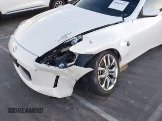 2014 Nissan 370Z Touring с VIN JN1AZ4EH2EM635420, выставлен на аукционе IAAI как лот 40862653 с пробегом 68 004 миль миль и . История ставок и продаж доступна на DreamBid. Изображение 6.