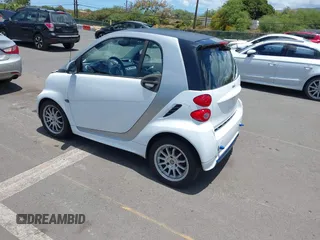 2013 Smart fortwo Pure with VIN WMEEJ3BA8DK605597, listed as a IAAI auction lot 42395754 with 55,637 mi miles and . Bid and sale history available at DreamBid. Image 3.