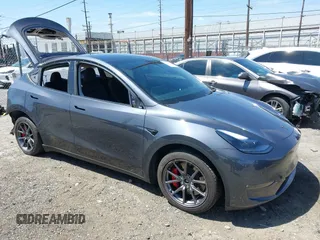 2023 Tesla Model Y Performance z VIN 7SAYGDEFXPF618668, wystawiony jako IAAI lot #42076853 z przebiegiem 56 263 mil mil oraz . Historia ofert i sprzedaży dostępna na DreamBid. Obrazek 1.