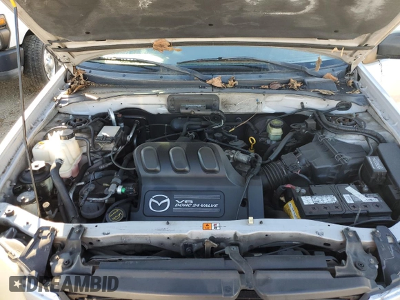 2001 Mazda Tribute LX with VIN 4F2CU08111KM20113, listed as a Copart auction lot 87681195 with 144,400 mi miles and Salvage Title. Bid and sale history available at DreamBid. Image 12.