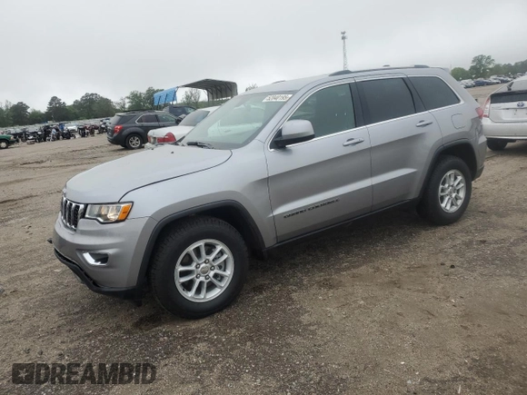 2020 Jeep Grand Cherokee Laredo E with VIN 1C4RJEAG0LC373572, listed as a Copart auction lot 52040195 with 86,604 mi miles and Salvage title. Bid and sale history available at DreamBid. Image 1.
