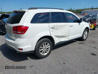 2015 Dodge Journey SXT with VIN 3C4PDCBG4FT727376, listed as a IAAI auction lot 42029881 with 151,042 mi miles. Bid and sale history available at carsss.com. Image 4.