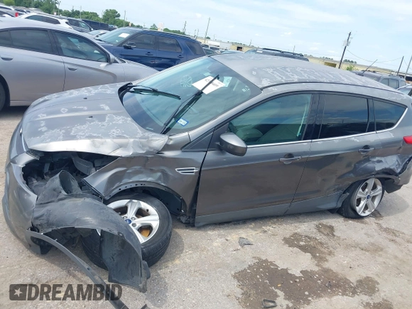 2014 Ford Escape SE z VIN 1FMCU9GX9EUC01478, wystawiony jako IAAI lot #42370409 z przebiegiem 158 154 mil mil oraz . Historia ofert i sprzedaży dostępna na DreamBid. Obrazek 6.