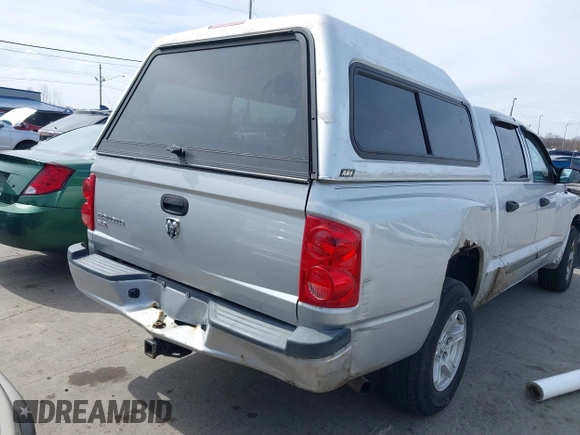 2007 Dodge Dakota SLT with VIN 1D7HE48K57S147503, listed as a IAAI auction lot 41858271 with 242,534 mi miles and . Bid and sale history available at DreamBid. Image 4.