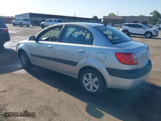 2009 Kia Rio SX with VIN KNADE223296523842, listed as a IAAI auction lot 42024905 with 98,613 mi miles. Bid and sale history available at carsss.com. Image 3.