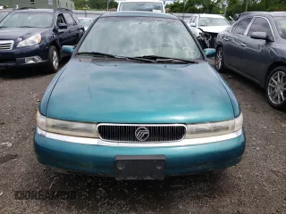 1996 Mercury Mystique z VIN 3MELM6530TM601366, wystawiony jako Copart lot #74239734 z przebiegiem 90 989 mil mil oraz Nie do naprawy. Historia ofert i sprzedaży dostępna na DreamBid. Obrazek 5.
