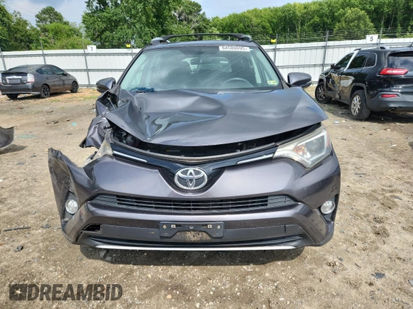 2016 Toyota RAV4 XLE with VIN 2T3RFREV4GW478667, listed as a Copart auction lot 64580095 with 70,593 mi miles and Salvage title. Bid and sale history available at DreamBid. Image 5.