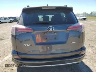 2018 Toyota RAV4 XLE with VIN JTMWFREV3JJ729302, listed as a Copart auction lot 49823765 with 100,576 mi miles and Salvage Title. Bid and sale history available at DreamBid. Image 6.
