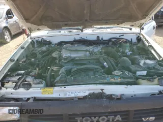 1991 Toyota Pickup DLX z VIN JT4VN13D4M5065504, wystawiony jako Copart lot #54058595 z przebiegiem 108 782 mil mil oraz Tytuł czysty. Historia ofert i sprzedaży dostępna na DreamBid. Obrazek 11.