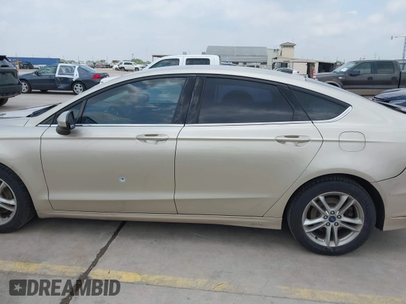 2018 Ford Fusion SE z VIN 3FA6P0H75JR176394, wystawiony jako IAAI lot #42169780 z przebiegiem 65 617 mil mil oraz . Historia ofert i sprzedaży dostępna na DreamBid. Obrazek 14.