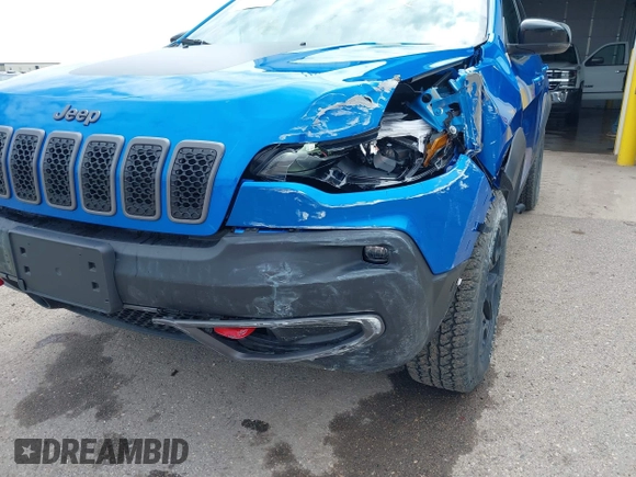 2022 Jeep Cherokee Trailhawk z VIN 1C4PJMBX4ND513488, wystawiony jako IAAI lot #42137114 z przebiegiem 12 306 mil mil oraz . Historia ofert i sprzedaży dostępna na DreamBid. Obrazek 17.