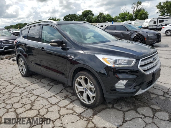 2018 Ford Escape Titanium with VIN 1FMCU0J92JUC84901, listed as a Copart auction lot 60428635 with 69,210 mi miles and Salvage title. Bid and sale history available at DreamBid. Image 4.