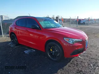 2021 Alfa Romeo Stelvio Ti z VIN ZASPAKBN1M7D11070, wystawiony jako IAAI lot #41772575 z przebiegiem 61 288 mil mil oraz . Historia ofert i sprzedaży dostępna na DreamBid. Obrazek 1.