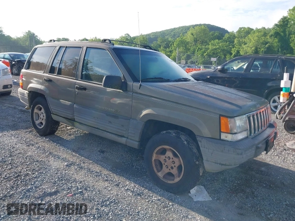 1997 Jeep Grand Cherokee Laredo with VIN 1J4GZ58S1VC603868, listed as a IAAI auction lot 42467813 with 297,306 mi miles and . Bid and sale history available at DreamBid. Image 1.