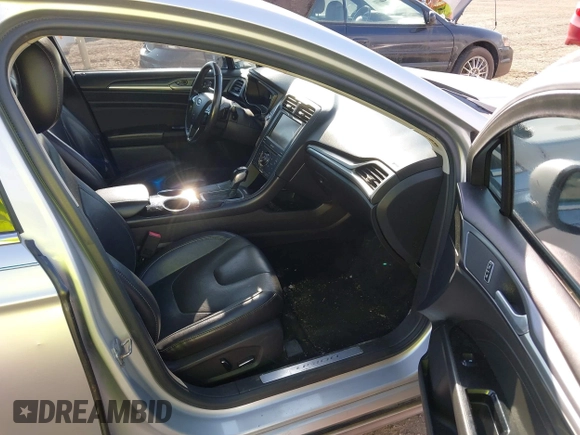 2013 Ford Fusion Titanium with VIN 3FA6P0K92DR200035, listed as a IAAI auction lot 42798129 with 242,831 mi miles and . Bid and sale history available at DreamBid. Image 5.