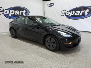 2023 Tesla Model 3 with VIN 5YJ3E1EA4PF452809, listed as a Copart auction lot 63688885 with 125,442 mi miles and Clean title. Bid and sale history available at DreamBid. Image 4.