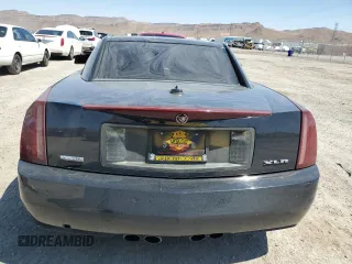 2004 Cadillac XLR z VIN 1G6YV34A345603061, wystawiony jako Copart lot #67412674 z przebiegiem 88 335 mil mil oraz Szkody całkowita. Historia ofert i sprzedaży dostępna na DreamBid. Obrazek 6.