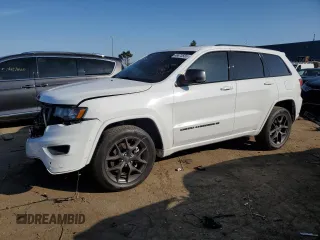 2021 Jeep Grand Cherokee 80th Anniversary with VIN 1C4RJFBG6MC674921, listed as a Copart auction lot 49873555 with 52,668 mi miles and Salvage Title. Bid and sale history available at DreamBid. Image 1.