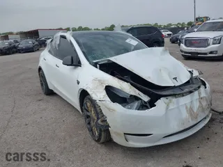 2023 Tesla Model Y Performance with VIN 7SAYGDEF1PF700871, listed as a IAAI auction lot 41938984 with 26,104 mi miles. Bid and sale history available at carsss.com. Image 1.