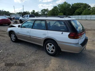 1999 Subaru Legacy Outback with VIN 4S3BG6850X7649578, listed as a Copart auction lot 56654155 with 174,651 mi miles and Salvage title. Bid and sale history available at DreamBid. Image 2.