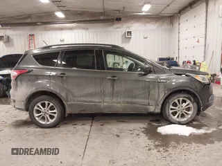 2018 Ford Escape SE with VIN 1FMCU9GD8JUA53114, listed as a IAAI auction lot 41592808 with 167,659 mi miles. Bid and sale history available at carsss.com. Image 13.